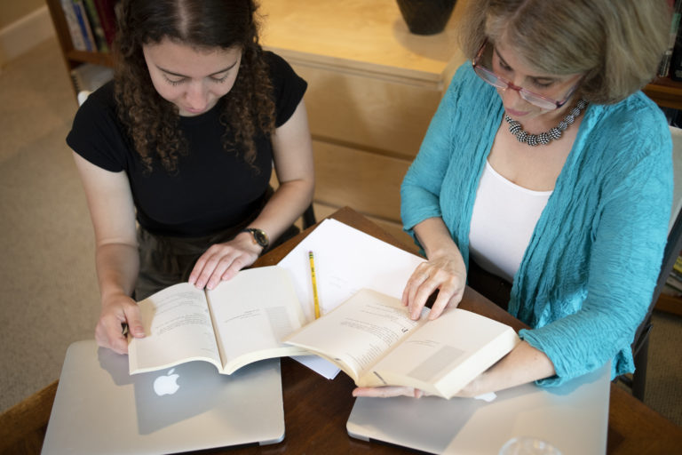 Photo of two women reading book